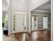 Bright foyer with hardwood floors, high ceilings, and natural light streaming through large windows at 4275 Green Summers Dr, Cumming, GA 30028