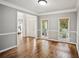 Inviting foyer featuring hardwood floors, neutral paint colors, and views to the front porch at 4275 Green Summers Dr, Cumming, GA 30028