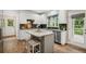 Well-lit kitchen with island seating, granite countertops, stainless steel appliances and access to a patio at 4275 Green Summers Dr, Cumming, GA 30028