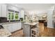 Beautiful kitchen with white cabinets, granite countertops, stainless steel appliances, and a center island at 4275 Green Summers Dr, Cumming, GA 30028