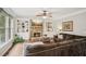 Cozy living room with stone fireplace, built-in bookshelves, and comfortable seating arrangement at 4275 Green Summers Dr, Cumming, GA 30028