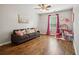 Living room featuring hardwood floors, a gray couch, and a large window at 4275 Green Summers Dr, Cumming, GA 30028