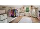 A well-organized walk-in closet with custom shelving, and hardwood floors at 4275 Green Summers Dr, Cumming, GA 30028