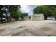 Rear view of home with concrete drive and detached garage at 6109 N Main Se St, Acworth, GA 30101