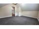 Cozy bedroom featuring gray carpeting, an interior door, and access to another room at 6109 N Main Se St, Acworth, GA 30101
