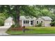 Charming single-Gathering home with stone accents, manicured lawn, and mature tree at 6109 N Main Se St, Acworth, GA 30101