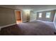 Bright living room with plush carpeting and natural light at 6109 N Main Se St, Acworth, GA 30101