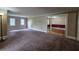 Spacious living room with carpet flooring and neutral paint at 6109 N Main Se St, Acworth, GA 30101