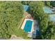 Aerial shot of a community pool and tennis courts surrounded by trees at 845 Connell Ln, Lawrenceville, GA 30044