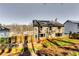 Two-story home with gray siding and fenced backyard, complete with a deck, grill, and green space for outdoor enjoyment at 845 Connell Ln, Lawrenceville, GA 30044