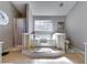 Bright bathroom featuring a corner tub with a large window and separate shower area at 845 Connell Ln, Lawrenceville, GA 30044