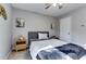 Comfortable bedroom featuring a ceiling fan, natural light, and neutral decor at 845 Connell Ln, Lawrenceville, GA 30044