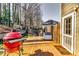 Cozy outdoor deck with a grill and ample seating, ideal for entertaining or relaxing at 845 Connell Ln, Lawrenceville, GA 30044