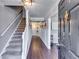 Welcoming entryway featuring hardwood floors, a staircase, and elegant details for a sophisticated first impression at 845 Connell Ln, Lawrenceville, GA 30044