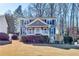 Charming two-story home with a covered front porch, a well-maintained lawn, and mature trees offering shade at 845 Connell Ln, Lawrenceville, GA 30044