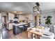 Modern kitchen with stainless appliances, island with seating, and hardwood floors at 845 Connell Ln, Lawrenceville, GA 30044