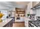 Modern kitchen with stainless steel appliances, hardwood floors, and white subway tile at 845 Connell Ln, Lawrenceville, GA 30044