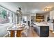 Eat in kitchen with stainless appliances, island with seating, and hardwood floors at 845 Connell Ln, Lawrenceville, GA 30044