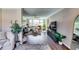 Spacious living room featuring hardwood floors, comfortable seating, and a ceiling fan for added comfort and style at 845 Connell Ln, Lawrenceville, GA 30044