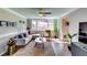 Comfortable living room with a modern sofa, stylish decor, and abundant natural light creating a cozy and inviting atmosphere at 845 Connell Ln, Lawrenceville, GA 30044