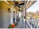 Comfortable covered front porch with ceiling fans, stylish decor, and ample space for relaxation and enjoying the outdoors at 845 Connell Ln, Lawrenceville, GA 30044