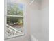 Window view in shower with blinds, a white surround, and an exterior shot through the blinds at 111 Abingdon Way, Sandy Springs, GA 30328