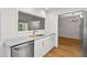 Bright kitchen with white cabinets, granite countertops, and stainless steel appliances at 111 Abingdon Way, Sandy Springs, GA 30328