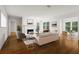 Sunlit living room with fireplace, hardwood floors, and views to office space at 111 Abingdon Way, Sandy Springs, GA 30328