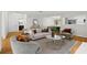 Bright and airy living room with hardwood floors and neutral-toned furniture and modern decor at 111 Abingdon Way, Sandy Springs, GA 30328