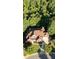 An aerial view showcases a stately home with a well-kept lawn and mature trees at 5114 Brendlynn Dr, Suwanee, GA 30024