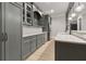 Basement wet bar with granite countertops, stainless refrigerator, wine cooler and shaker cabinets at 5114 Brendlynn Dr, Suwanee, GA 30024