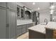 Basement wet bar featuring granite countertops, stainless refrigerator, wine cooler, cabinets and lighting at 5114 Brendlynn Dr, Suwanee, GA 30024