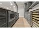 Basement wet bar with a wine cooler, microwave and shaker cabinets with stainless steel handles at 5114 Brendlynn Dr, Suwanee, GA 30024