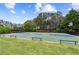 Outdoor basketball court with hoops, benches, and a well-maintained playing surface for sports and recreation at 5114 Brendlynn Dr, Suwanee, GA 30024