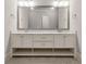 Bathroom featuring double vanity with marble countertop at 5114 Brendlynn Dr, Suwanee, GA 30024