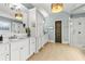 Bathroom with double vanities, granite countertop, decorative mirrors, and a glass enclosed shower at 5114 Brendlynn Dr, Suwanee, GA 30024