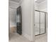 Bathroom featuring a glass-enclosed shower at 5114 Brendlynn Dr, Suwanee, GA 30024