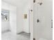 Bright bathroom with marble floor and frameless glass shower, providing a modern and clean aesthetic at 5114 Brendlynn Dr, Suwanee, GA 30024