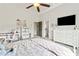 Bright bedroom boasts vaulted ceilings, ceiling fan, TV, dresser, desk, chair, and cozy furnishings at 5114 Brendlynn Dr, Suwanee, GA 30024