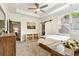 Bedroom with natural light, wood accents, and a sliding door, offering style and privacy at 5114 Brendlynn Dr, Suwanee, GA 30024