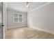 Neutral bedroom with large windows and hardwood floors at 5114 Brendlynn Dr, Suwanee, GA 30024