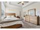 Bright bedroom with natural wood furniture, plush carpet, and large windows, creating a tranquil retreat at 5114 Brendlynn Dr, Suwanee, GA 30024