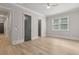This bedroom has hardwood floors, neutral paint, a ceiling fan, and natural light from the large window at 5114 Brendlynn Dr, Suwanee, GA 30024