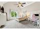 Cozy bedroom with large window, vaulted ceiling, and a charming, comfortable atmosphere at 5114 Brendlynn Dr, Suwanee, GA 30024