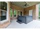 Relax in style with this covered deck and hot tub at 5114 Brendlynn Dr, Suwanee, GA 30024