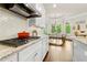 Kitchen featuring stainless steel appliances, granite countertops and breakfast nook at 5114 Brendlynn Dr, Suwanee, GA 30024