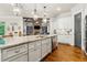 Gourmet kitchen with stainless steel appliances, granite countertops, and an island with seating at 5114 Brendlynn Dr, Suwanee, GA 30024