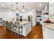 Beautiful kitchen with granite countertops, stainless steel appliances, and pendant lighting at 5114 Brendlynn Dr, Suwanee, GA 30024