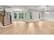 Bright living room with elegant hardwood floors and expansive windows offering picturesque views at 5114 Brendlynn Dr, Suwanee, GA 30024