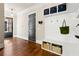 Functional mudroom with built-in storage, coat hooks, and easy access to entryway at 5114 Brendlynn Dr, Suwanee, GA 30024